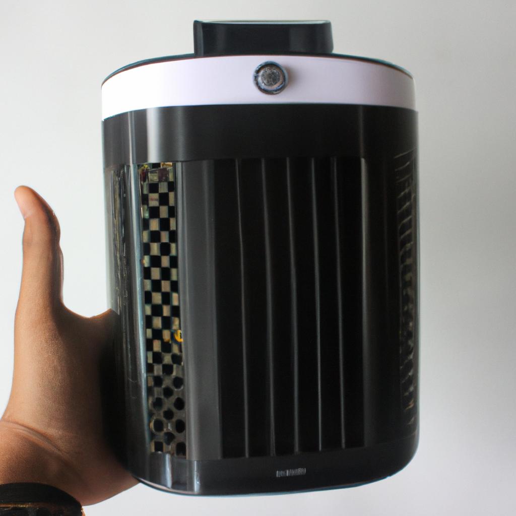 Person holding air purifier device