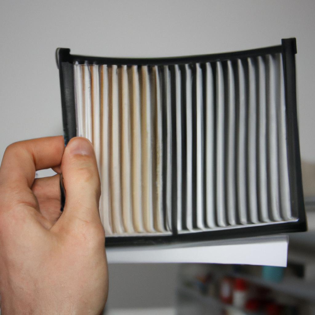 Person holding air filter samples